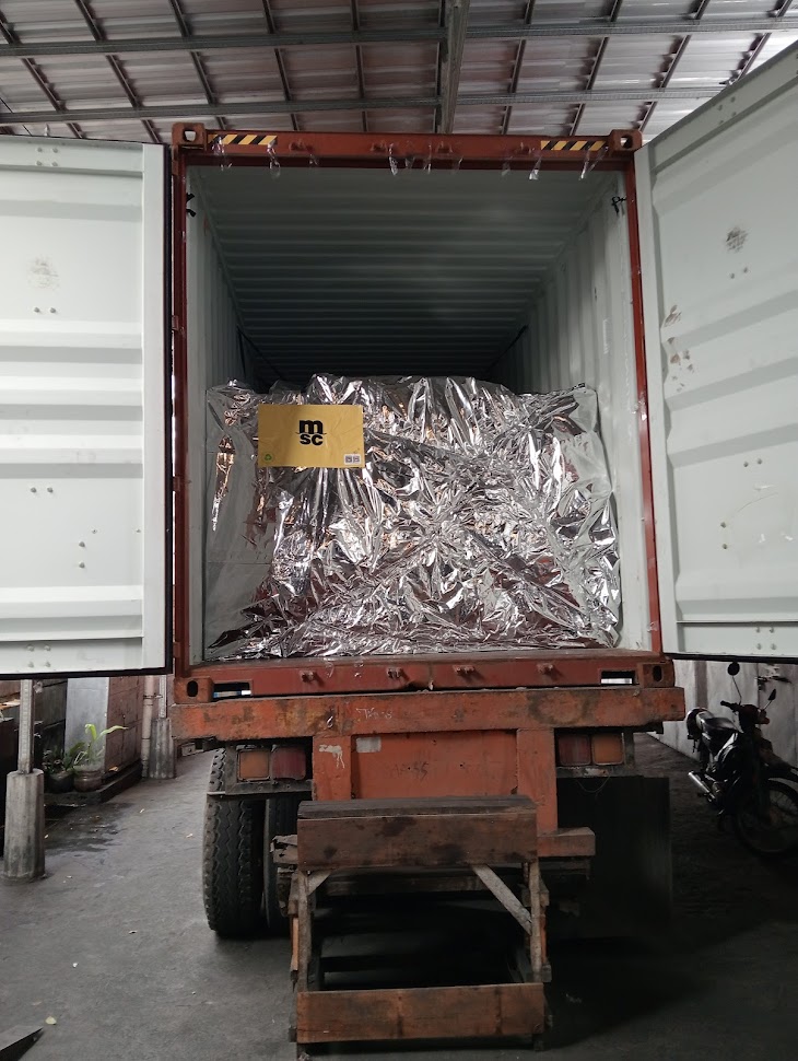 loading a container with BBQ charcoal to the USA
