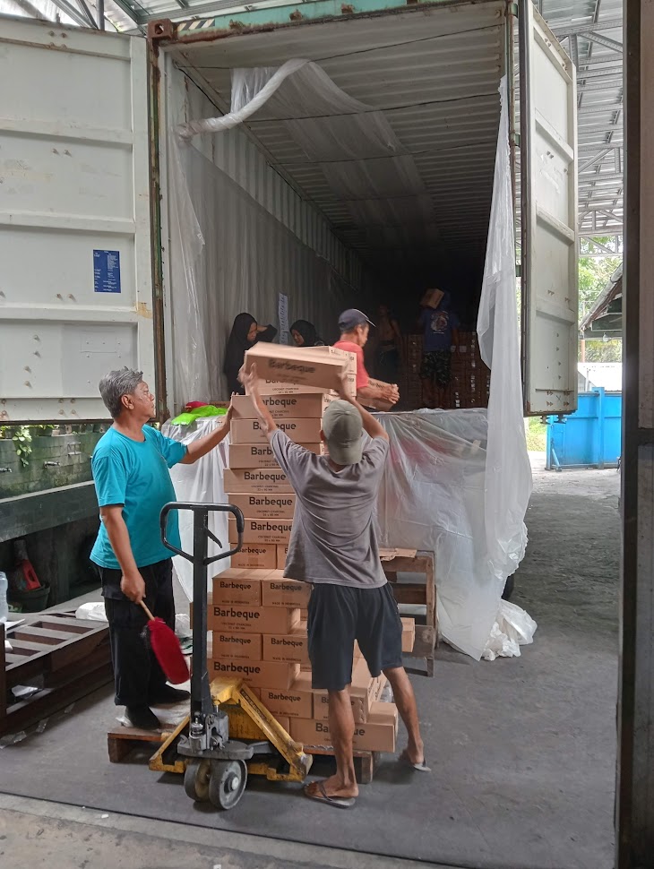 loading a container with BBQ charcoal to Australia